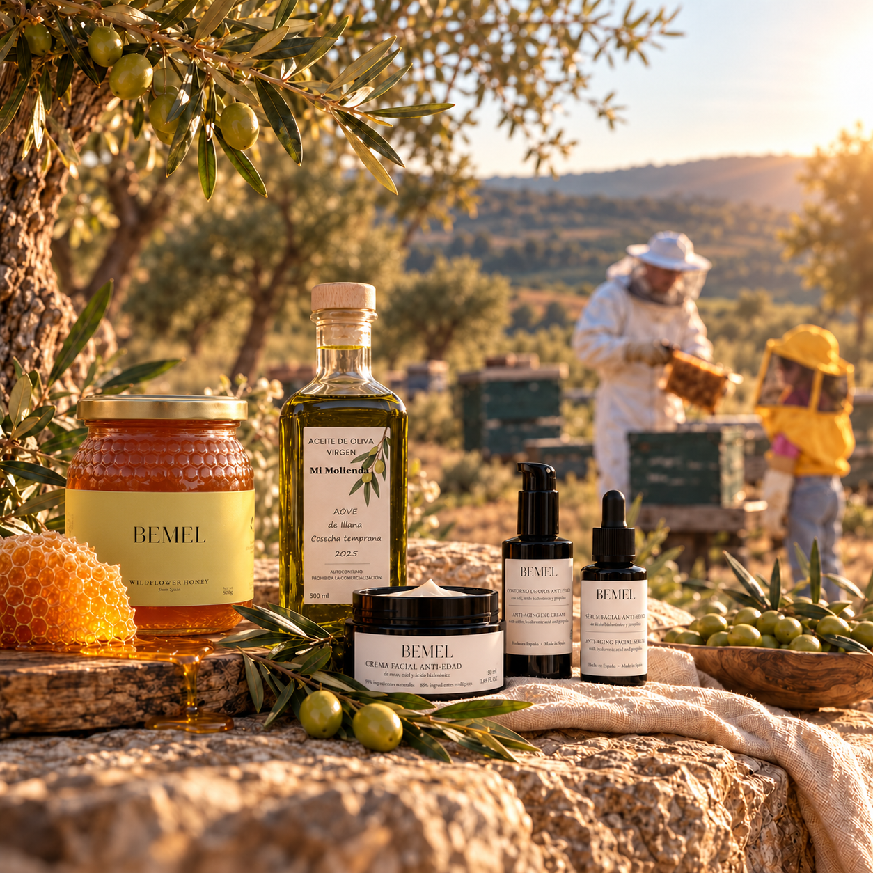 Productos BEMEL en el olivar dorado con colmenas al fondo